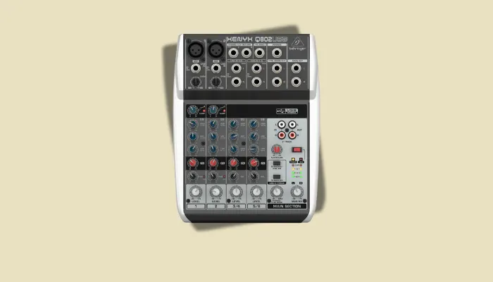 Small Behringer mixer with FX send, used to route vocal signals through guitar pedals