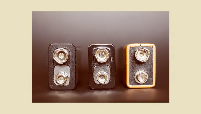 Three 9V batteries side by side, commonly used to power vintage-style fuzz pedals like germanium fuzz units.